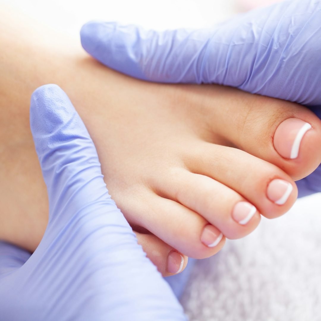 Pedicure Day. Pedicure Specialist Works With the Patient in Spa Salon