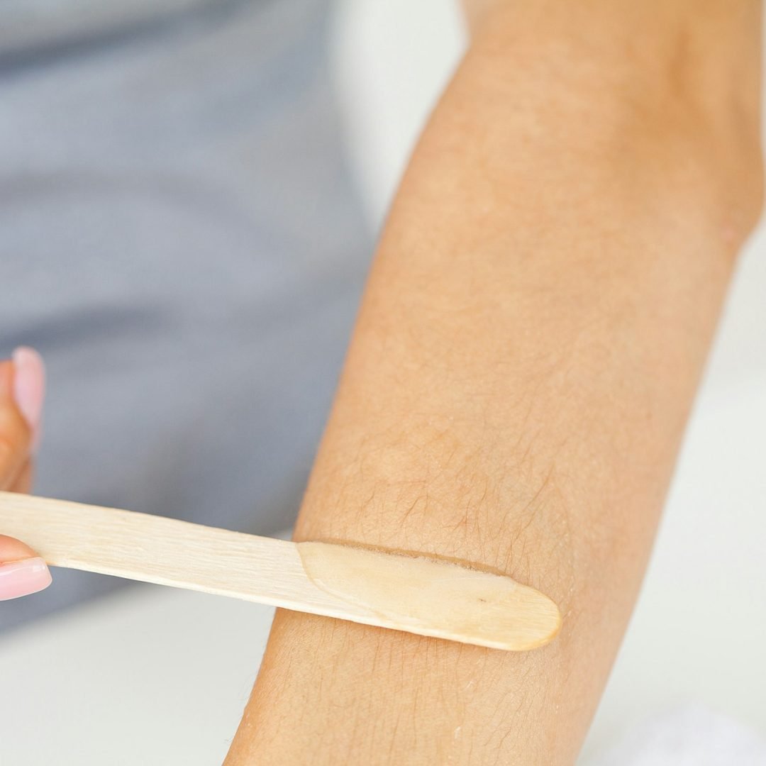 Process depilation female hands in a beauty salon