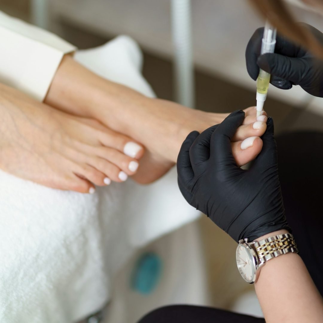 Woman making pedicure in beauty salon